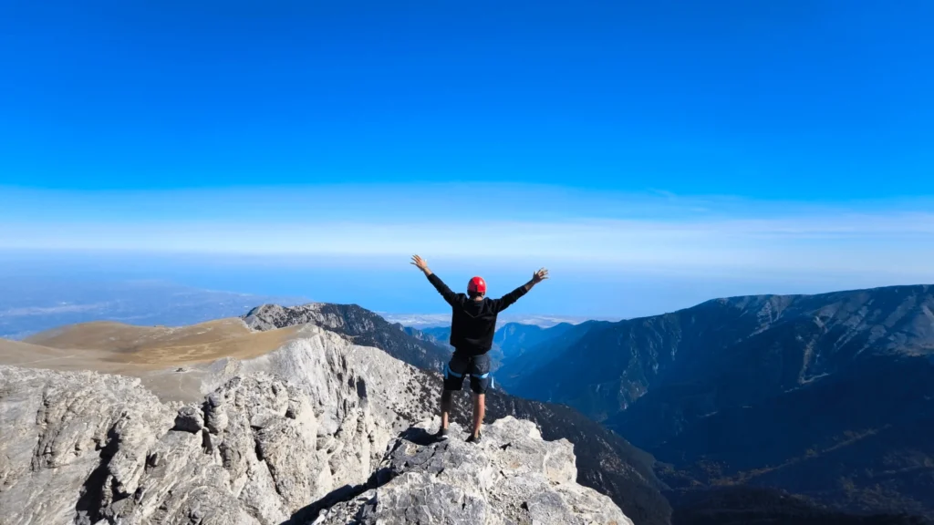 a hiker at Mytikas 2918 during the fast and light olympus summit experience